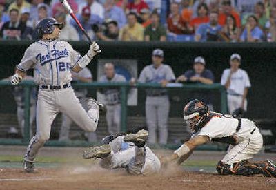 
UNC's Benji Johnson strikes out as Josh Horton tries to steal home to end 8th.
 (Associated Press / The Spokesman-Review)