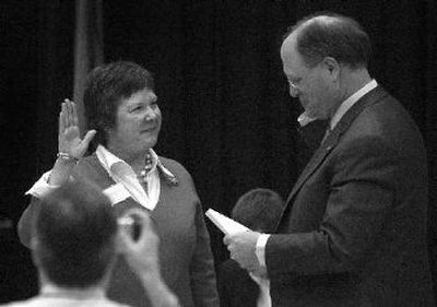 
Susan Chapin is sworn in as a school board member by Spokane Public Schools Superintendent Brian Benzel at the board's meeting at Wilson Elementary School. 
 (Liz Kishimoto / The Spokesman-Review)