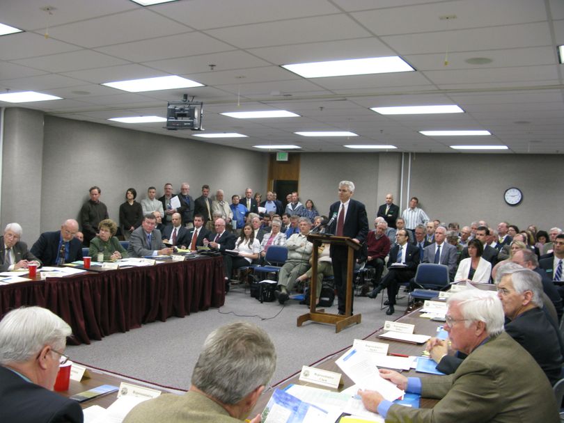 The hearing room is packed on Monday morning for a public hearing on legislation to raise Idaho's beer and wine taxes for the first time in more than four decades. Keith Allred, a former Harvard professor who heads the good-government group The Common Interest, presents the bill to the committee to begin the public hearing, 2/23/09 (Betsy Russell / The Spokesman-Review)