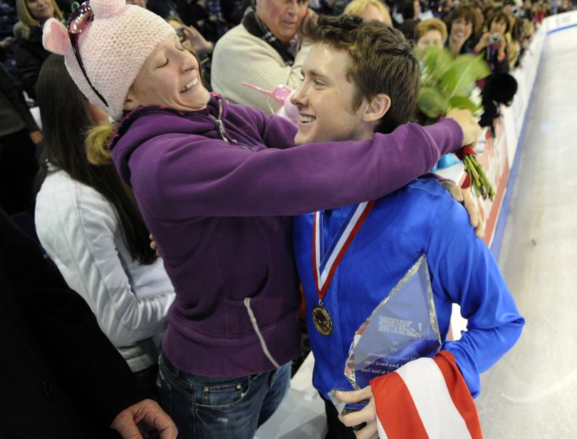 After the medal ceremony, championship senior men's program gold medalist, Jeremy Abbott, greets his sister, Gwen Abbott, in the stands Sunday, Jan. 17, 2010, in the Spokane Arena. (Colin Mulvany / The Spokesman-Review)