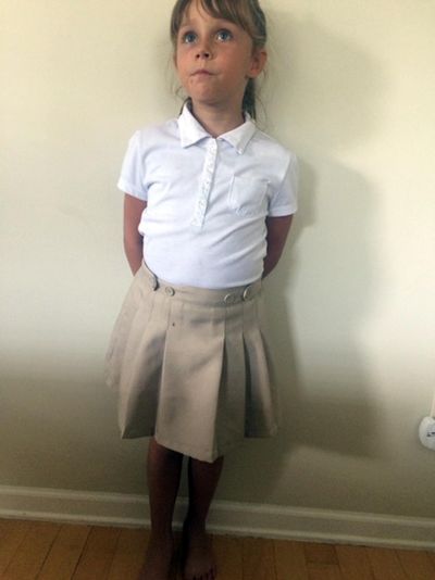 This July 24, 2017, photo provided by Bonnie Peltier shows her daughter at their home in Winnabow, N.C. Peltier sued her daughter’s charter school because it required girls to wear skirts and forbid them from wearing pants. A federal judge ruled on Thursday, March 28, 2019, that Charter Day School’s skirts-only rule for girls was unconstitutional sex discrimination. (Bonnie Peltier / AP)