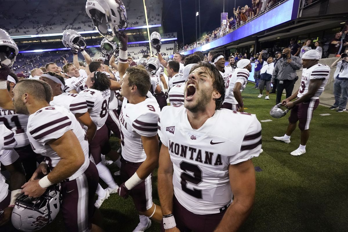 Montana quarterback Cam Humphrey lets out a yell as he celebrates with teammates after they beat Washington in an NCAA college football game Saturday, Sept. 4, 2021, in Seattle. Montana won 13-7. (Associated Press)