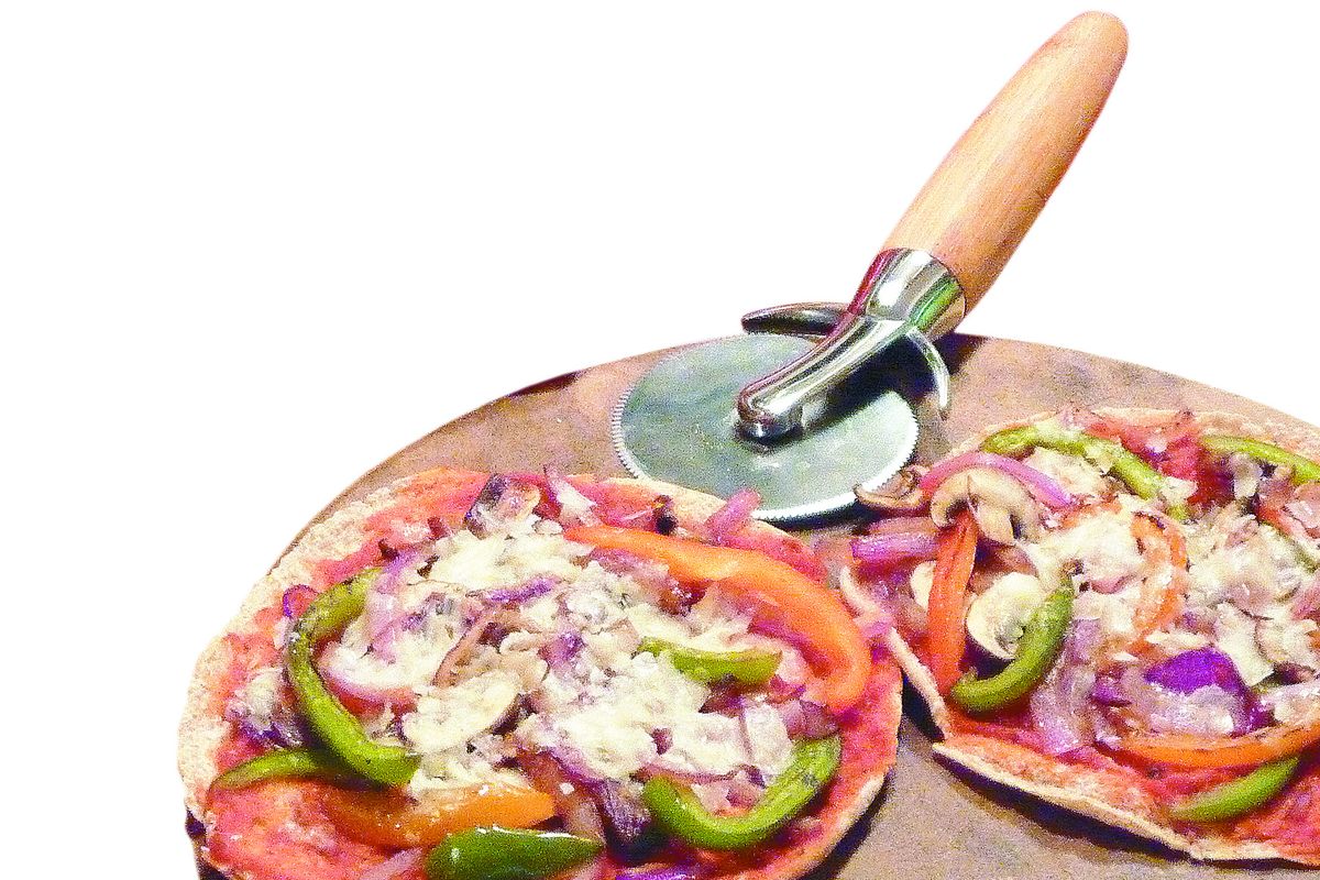 Using pita bread for a crust, you can make pizza faster, and more custom, than the time it takes to have pizza delivered.