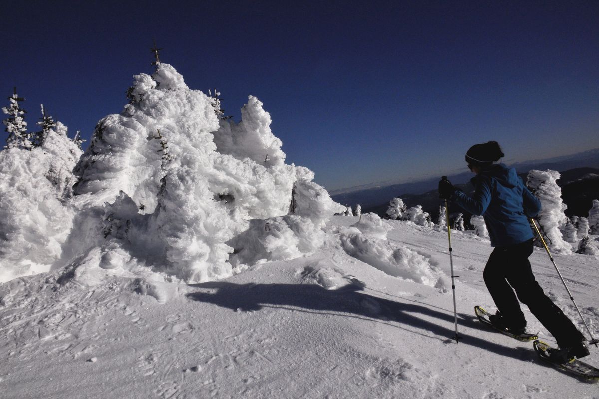 A snowshoer treks toward the summit of Mount Spokane. (Rich Landers)