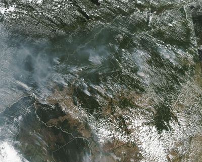 This satellite image from Aug. 13 shows several fires burning in the Brazilian Amazon forest. (NASA)