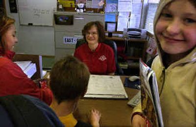 
During her Friday volunteer day at the East Central COPS substation, 3001 E. Fifth Ave., Susan Gubler is visited by schoolchildren. From right are Galina Nesenchuk, 12; Brecken Butler, 10; and Jodaesha Wells, 11, stopping to get candy.During her Friday volunteer day at the East Central COPS substation, 3001 E. Fifth Ave., Susan Gubler is visited by schoolchildren. From right are Galina Nesenchuk, 12; Brecken Butler, 10; and Jodaesha Wells, 11, stopping to get candy.
 (Jed Conklin/Jed Conklin/ / The Spokesman-Review)