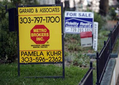 
Signs stack up outside homes for sale in Denver on Monday. Associated Press
 (Associated Press / The Spokesman-Review)