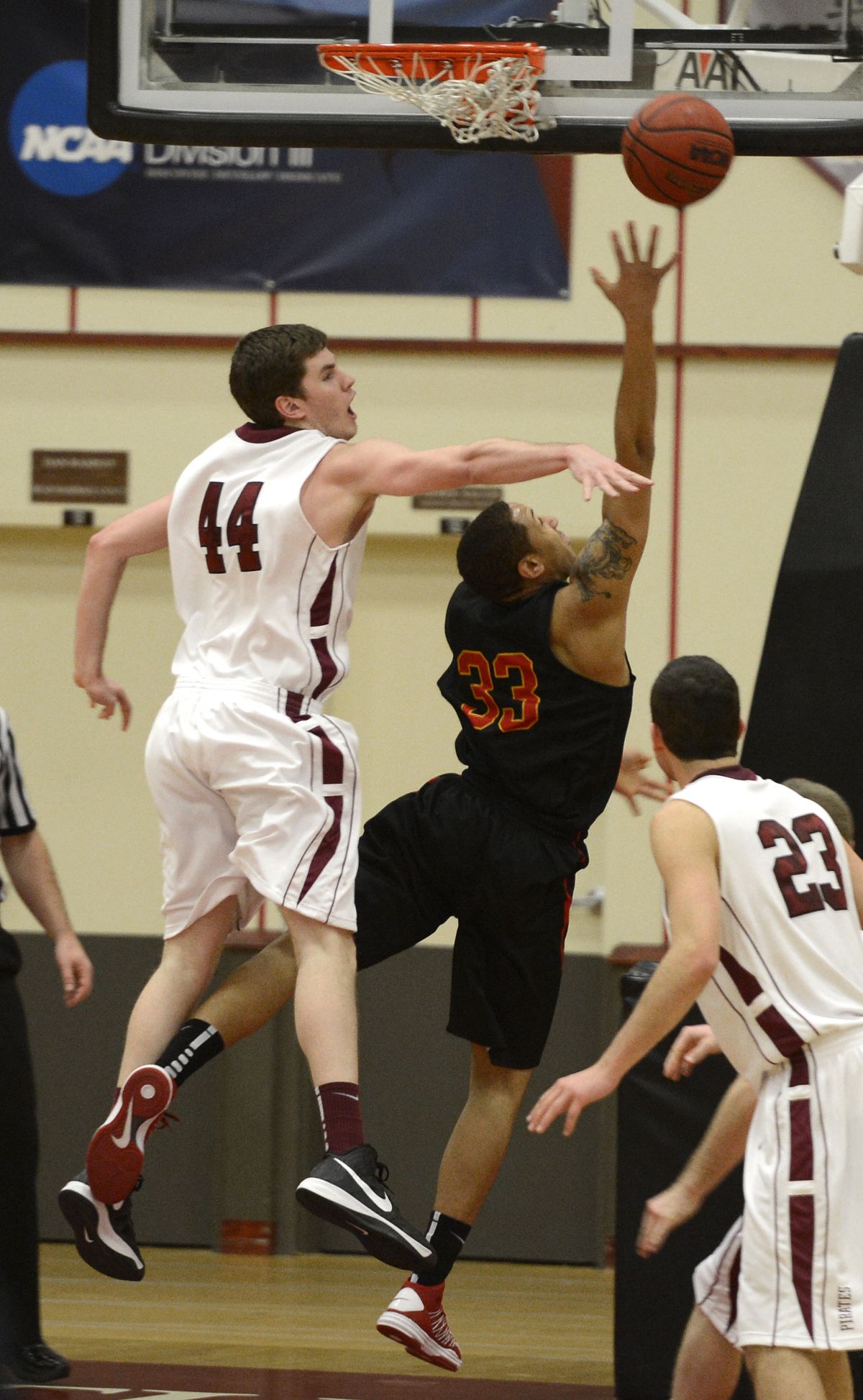 Whitworth’s Adam Wilks applies defensive pressure to Simpson’s AJ Arrington in the first half. (Dan Pelle)