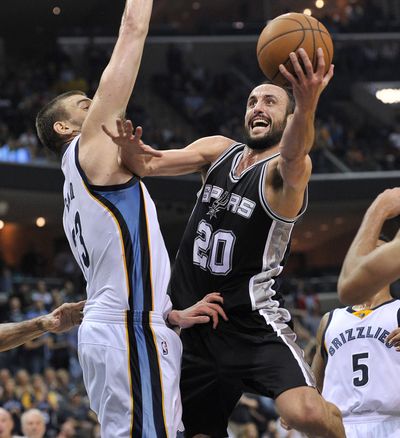 Spurs guard Manu Ginobili shoots in Spurs’ win over Grizzlies. (Associated Press)