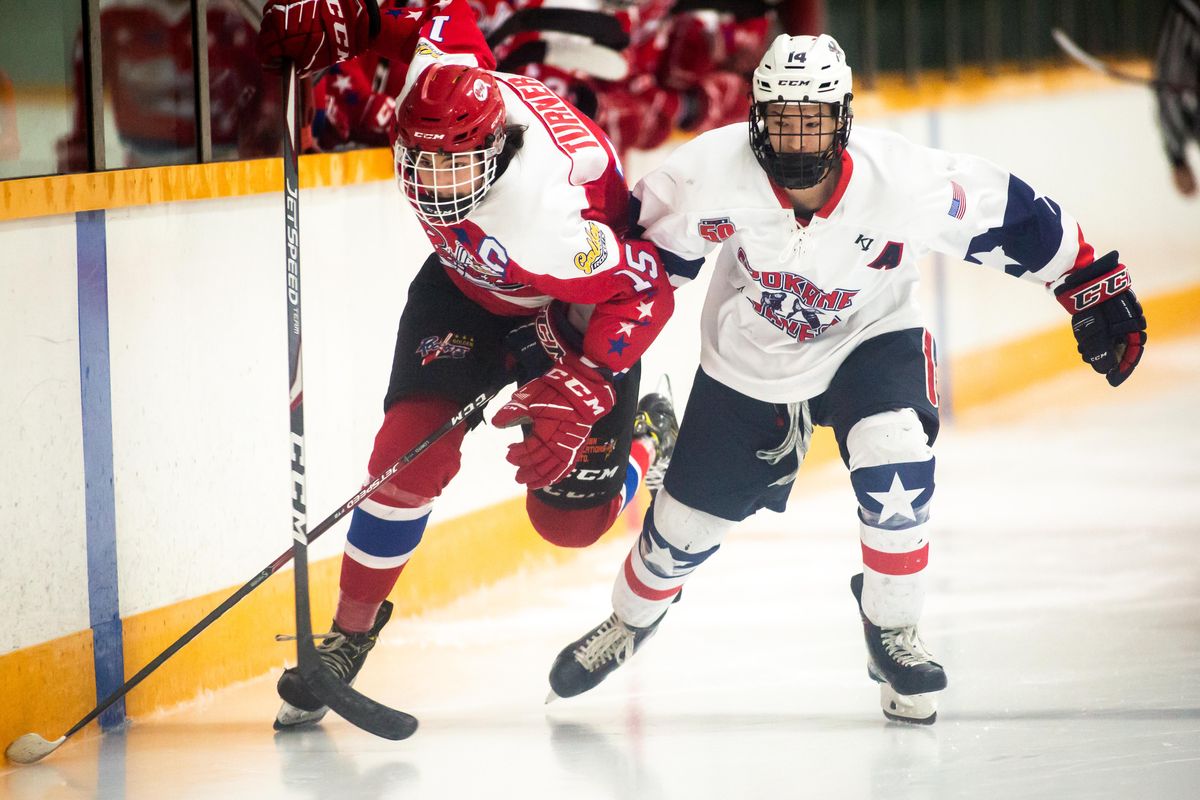 Derek Humphreys of the Spokane Braves, vies for the puck versus Dominic Turner of the Golden Rockets during a junior B hockey team on Sunday, Jan. 19, 2020 at Eagles Ice Arena. Golden won 5-3. (Libby Kamrowski / The Spokesman-Review)