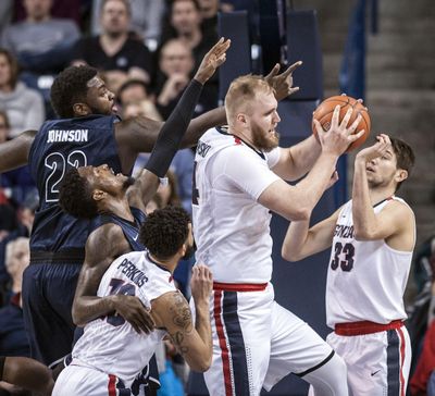 Gonzaga center Przemek Karnowski controls the boards against Akron on Dec. 10, 2016, in the McCarthey Athletic Center. (Dan Pelle / The Spokesman-Review)