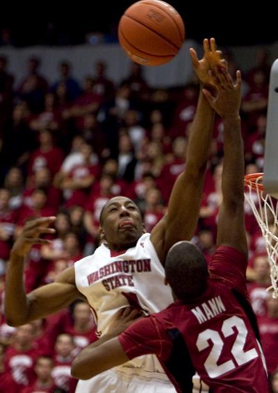 WSU’s  Marcus Capers blocks the layup attempt of Stanford’s  Jarrett Mann.  (Associated Press)