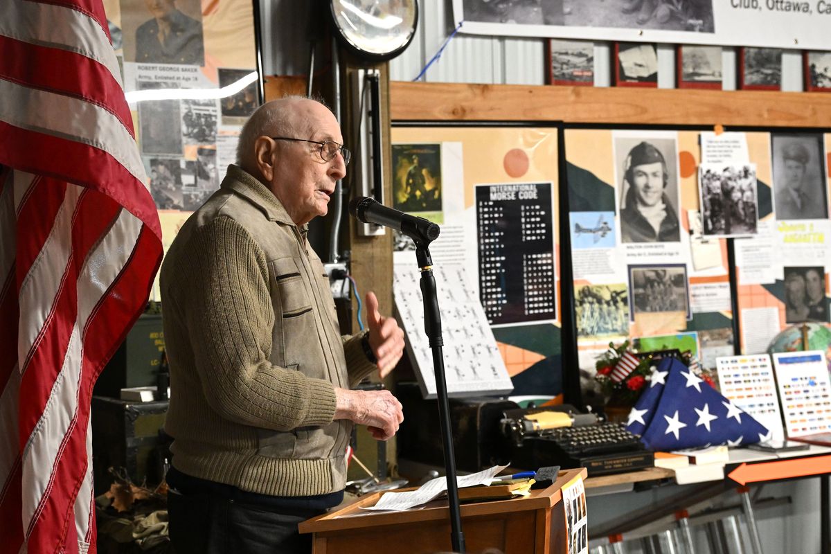 World War II veteran Harold Skinner, who will turn 100 Monday, speaks about his time in the U.S. Navy to a crowd gathered at the WWII Wall of Honor Exhibition event Tuesday. Spokane resident John Baker coordinated the program at his South Hill home to honor 10 WWII veterans (nine of whom have died) who are connected to Spokane.  (COLIN MULVANY/THE SPOKESMAN-REVIEW)