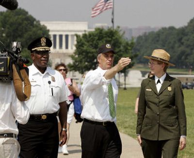 
Interior Secretary Dirk Kempthorne, center, visits the Washington Monument with U.S. Park Police Chief Dwight Pettiford, left, and Mall Superintendent Vikki Keys  on Tuesday. 
 (Associated Press / The Spokesman-Review)