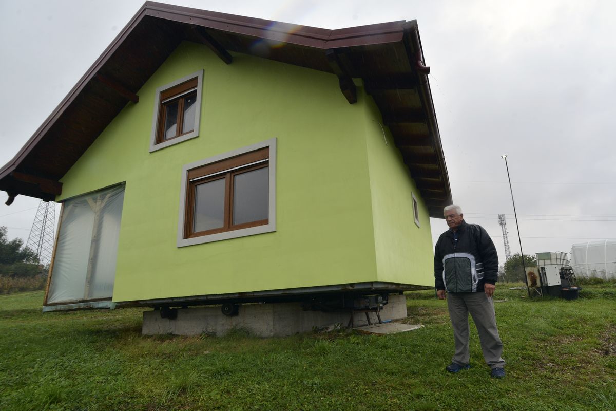 Vojin Kusic’s stands in front of his rotating house Sunday in a town of Srbac, northern Bosnia.  (Radivoje Pavicic)