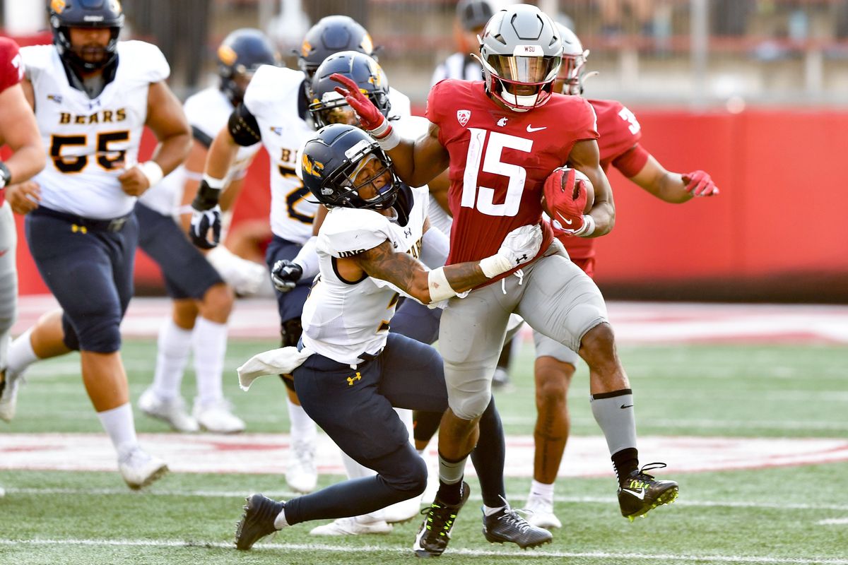 Washington State running back Djouvensky Schlenbaker fights for yardage against Northern Colorado during the second half of Saturday’s nonconference game in Pullman.  (Tyler Tjomsland/The Spokesman-Review)