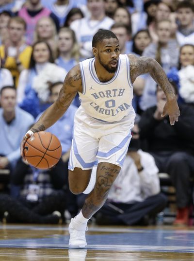 In this Feb. 11, 2019 photo, North Carolina’s Seventh Woods (0) dribbles against Virginia during the first half of an NCAA college basketball game in Chapel Hill, N.C. Seventh Woods, a highly regarded college prospect from South Carolina, hoped to make a big impact on North Carolina when he left to join the Tar Heels. Woods is back home to finish his college career with the Gamecocks. (Gerry Broome / Associated Press)