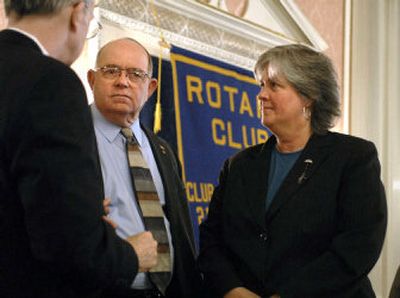 
Phil Harris, center, and Bonnie Mager chat with Robin Corkery  at a Rotary Club gathering at the Spokane Club on Thursday.  
 (Dan Pelle / The Spokesman-Review)