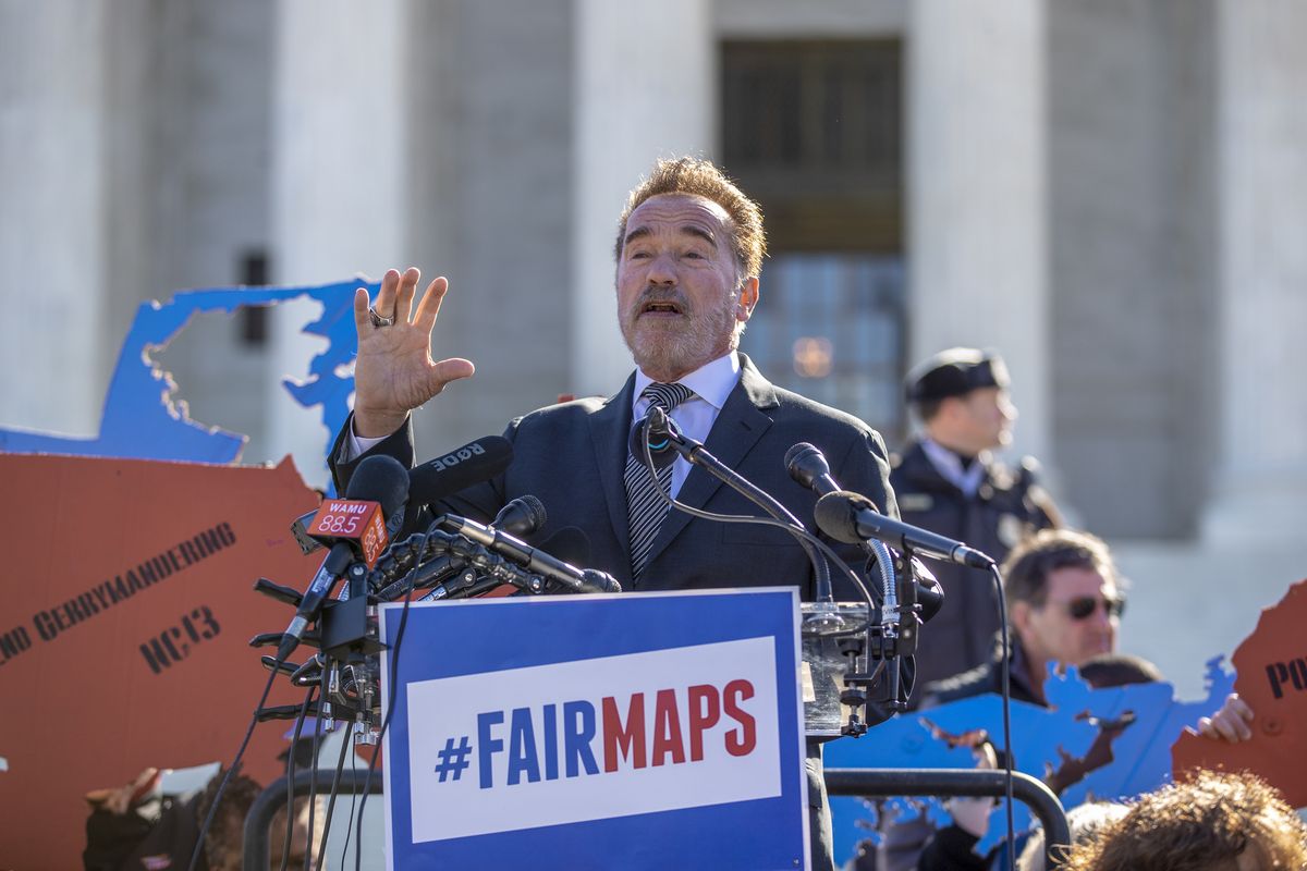 In this March 26, 2019 photo, former California Gov. Arnold Schwarzenegger speaks at a rally calling for "Fair Maps" at the Supreme Court in Washington. In California its last Republican governor, Arnold Schwarzenegger, passed a 2008 ballot measure creating a nonpartisan commission. (Carolyn Kaster)
