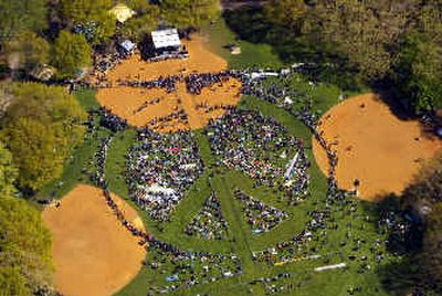 
Demonstrators form a human peace sign in New York's Central Park on Sunday. 
 (Associated Press / The Spokesman-Review)