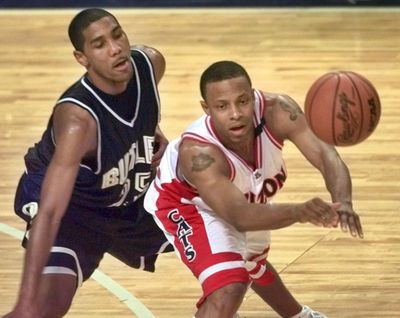 Former Butler star LaVall Jordan, left, guarding Arizona's Jason Gardner during a 2001 tournament game, has been named the school’s new head coach. (ED ZURGA / Associated Press)
