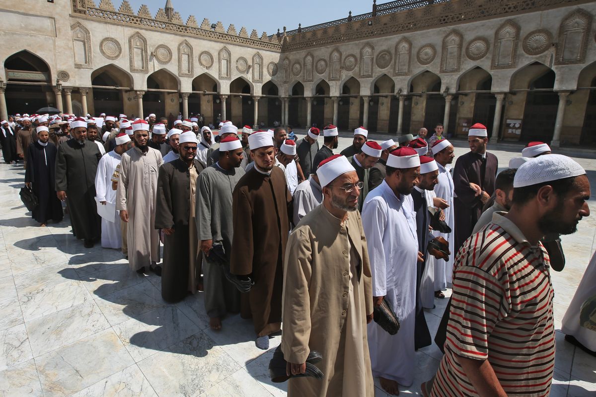 Egyptian clerics, supporting the ousted Egyptian President Mohammed Morsi, leave al-Azhar mosque following a protest in Cairo on Sunday. (Associated Press)