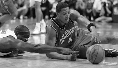 
Orlando's Tony Battie battles Chris Webber for a loose ball. 
 (Associated Press / The Spokesman-Review)