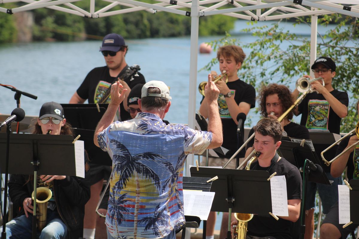 Stephan Friel, a professor of saxophone at Eastern Washington University, conducts the SAJE All Star High School Band during the "Jazz in the Air" Imagine Jazz Festival on Sunday at Riverfront Park in Spokane.  (Jordan Tolley-Turner/The Spokesman-Review.)