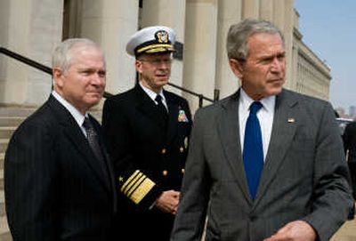 
Robert  Gates, left, and U.S. Navy Adm. Mike Mullen stand with President Bush Wednesday. Associated Press
 (Associated Press / The Spokesman-Review)