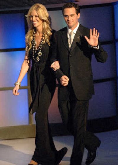 
 Season champ Jimmie Johnson and wife Chandra are in spotlight. 
 (Associated Press / The Spokesman-Review)