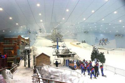 
People line up for a ski lift at the Ski Dubai park in Dubai. The facility is the third-largest indoor slope in the world, holding over 6,000 metric tons of snow and can accommodate around 1,500 people. With the United States, China and Japan already well-known for their large energy appetites, the Middle East is beginning to grab the market's attention with the increasing clip at which it burns petroleum. 
 (Associated Press photos / The Spokesman-Review)