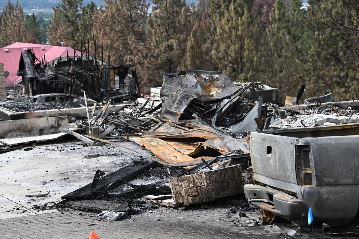 Little is left of the six homes on the west side of North Emerald Lane on Friday in the Northwoods area near Spokane Valley. They burned Tuesday in a wildfire that moved up the hillside above Camp Sekani. The fire, driven by high winds, crept up the draw behind the homes. (Jesse Tinsley/THE SPOKESMAN-REVIEW)