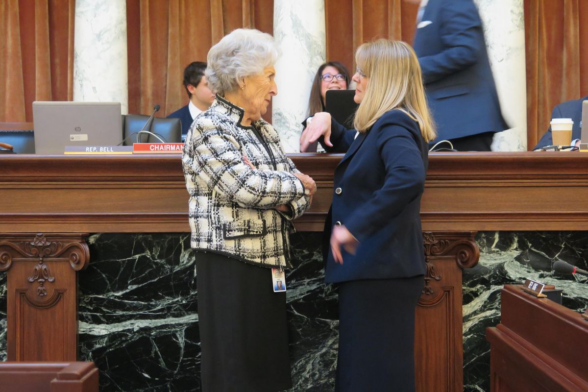 Rep. Maxine Bell, left, co-chair of the Idaho Legislature’s joint budget committee, talks with Rep. Wendy Horman, right, who led a bipartisan group of lawmakers who crafted the public school budget for next year, before the joint panel unanimously approved the budget on Monday, Feb. 19, 2018. (Betsy Z. Russell / The Spokesman-Review)