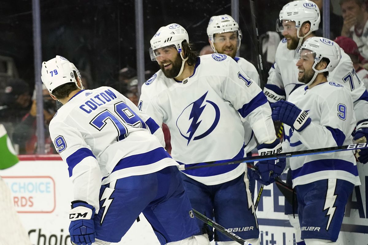 Tampa Bay Lightning left wing Pat Maroon (14) congratulates center Ross Colton (79) following Colton’s goal against the Carolina Hurricanes during the third period in Game 5 of an NHL hockey Stanley Cup second-round playoff series in Raleigh, N.C., Tuesday, June 8, 2021.  (Gerry Broome)