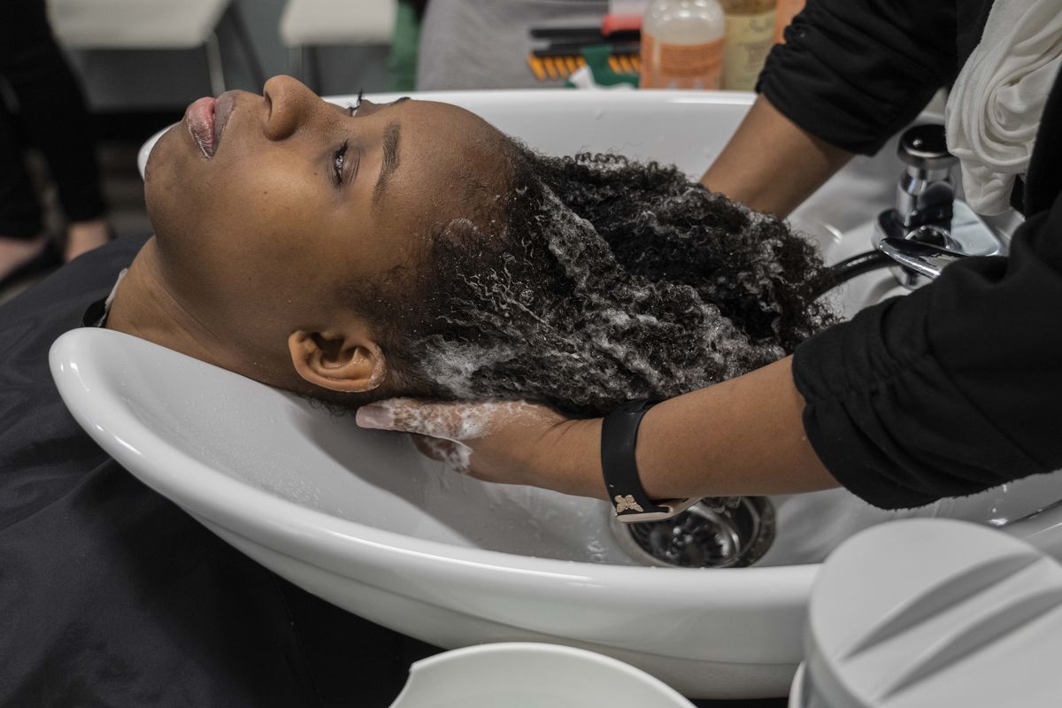 Melissa Williams, who came to the Unilever salon with her mother, in Trumbull, Conn., Thursday, March 2, 2023. Each week, the global conglomerate Unilever brings people into a salon to test new products. It's hoping to get a bigger piece of the long undervalued but growing Black beauty market. (Hiroko Masuike/The New York Times)  (HIROKO MASUIKE)