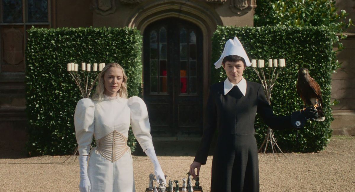 Maika Monroe, left, and Emma Corrin in Julia Jackman’s “100 Nights of Hero.”  (Independent Film Company)