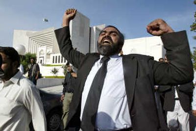 
A lawyer protests the decision Friday to dismiss challenges to President Pervez Musharraf's bid for another term. Associated Press
 (Associated Press / The Spokesman-Review)