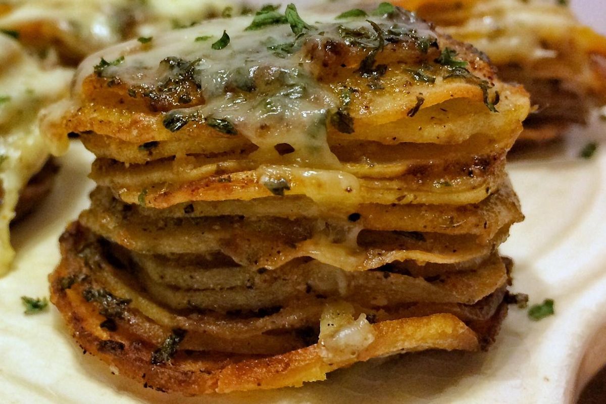 These cheesy potato stacks are a fun and tasty side dish that are so easy to make the kids can lend a hand. (Audrey Alfaro / For The Spokesman-Review)