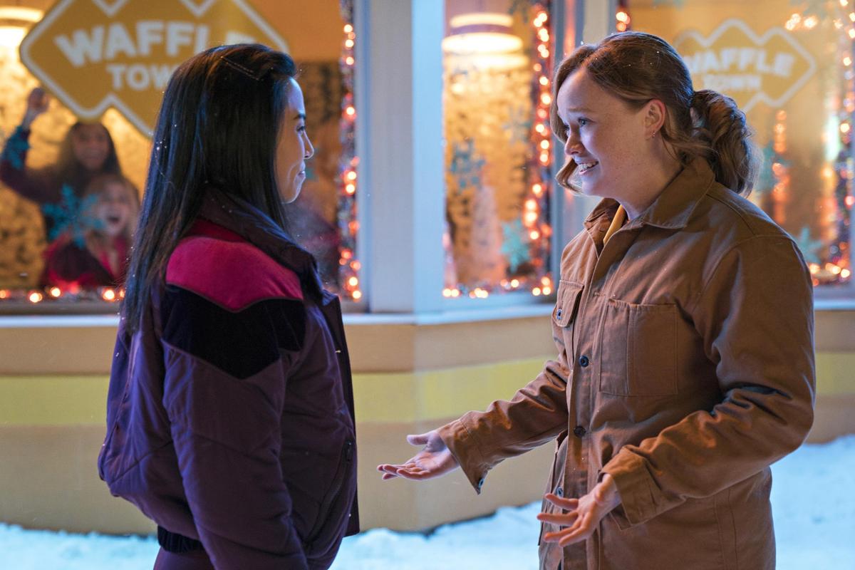 Anna Akana and Liv Hewson appear in the holiday movie “Let It Snow.” (Steve Wilkie / AP)