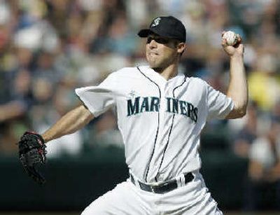 
Seattle Mariners starting pitcher Jake Woods throws against Texas Sunday. 
 (Associated Press / The Spokesman-Review)