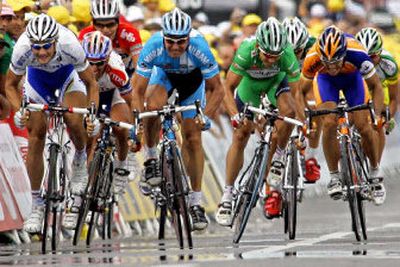 Oscar Freire of Spain, right, sprints to cross the finish ahead of Robbie McEwen of Australia, second right, Erik Zabel of Germany, second left, and Tom Boonen of Belgium, left, to win Tuesday's stage.
(Associated Press / The Spokesman-Review)
