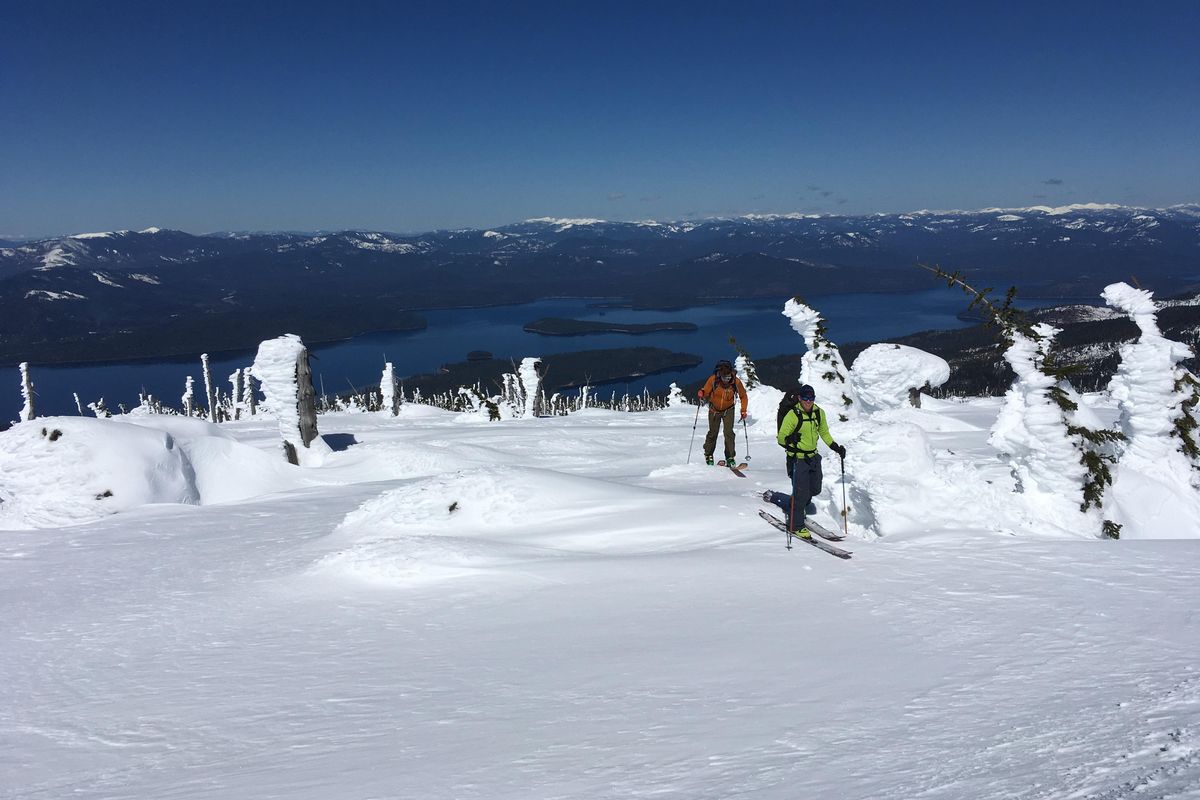 Jason Keen and Aaron Theisen ski tour high above Priest Lake on April 19. (Mike Brede / Courtesy)