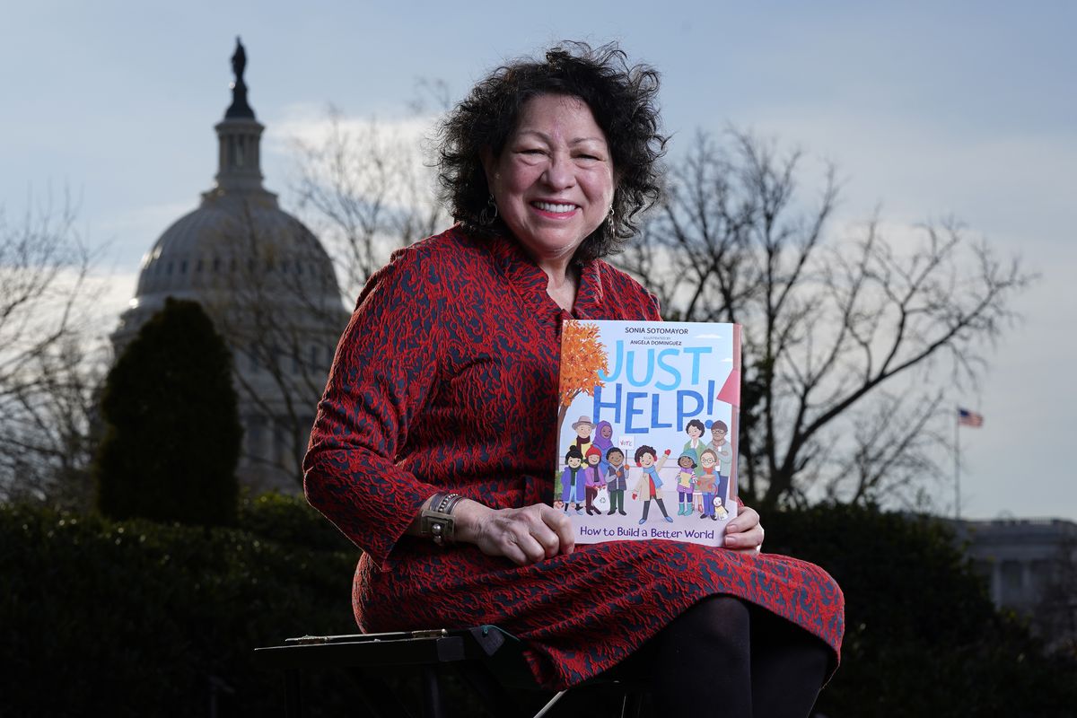 Supreme Court Associate Justice Sonia Sotomayor holds her new children