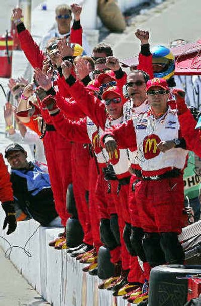 
The pit crew for French driver Sebastien Bourdais reacts as he wins the Toyota Grand Prix of Long Beach.
 (Associated Press / The Spokesman-Review)