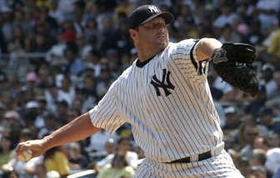 
Yankees pitcher Roger Clemens, right, exited Monday's game against Seattle early. Associated Press
 (Associated Press / The Spokesman-Review)