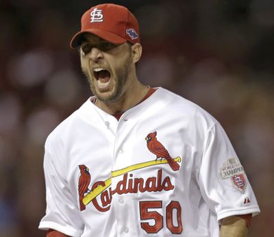 Cardinals pitcher Adam Wainwright gave up one run en route to win over Giants. (Associated Press)