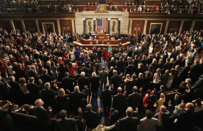 Members of the Congress, accompanied by family members and guests, are sworn in in the House Chamber on Capitol Hill.  (Associated Press / The Spokesman-Review)