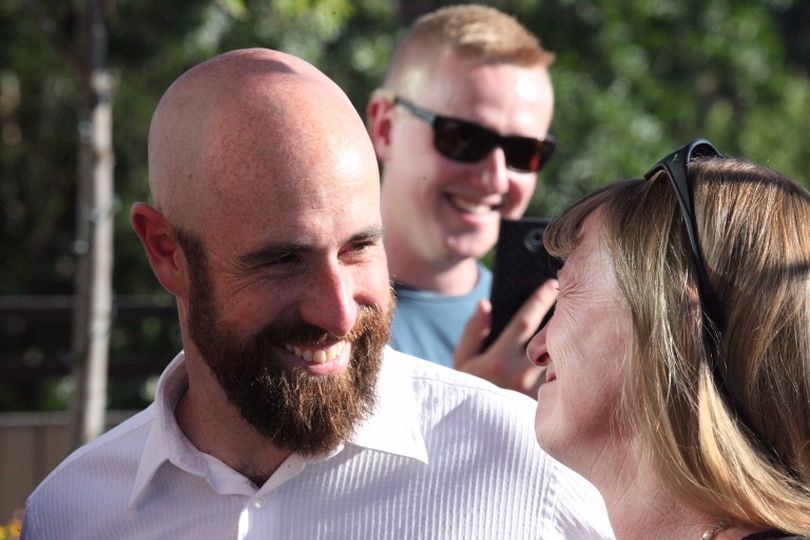 Luke Malek chats with his mother after his announcement that he's running for Congress. His brother is in the background. (Duane Rasmussen photo)