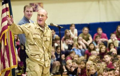 
Staff Sgt. Paul Fothergill talks about about his seven-month tour in Iraq on Friday at Bemiss Elementary School. In Iraq, he kept track of ammunition shipments.
 (Holly Pickett / The Spokesman-Review)