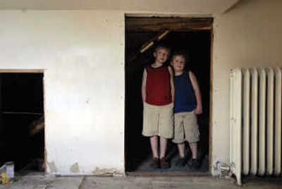 
Jack Bewick, 8, left, and his brother Josh, 5, inspect the third-floor bedroom that had concealed several historic keepsakes.
 (Photos by Jed Conklin/ / The Spokesman-Review)